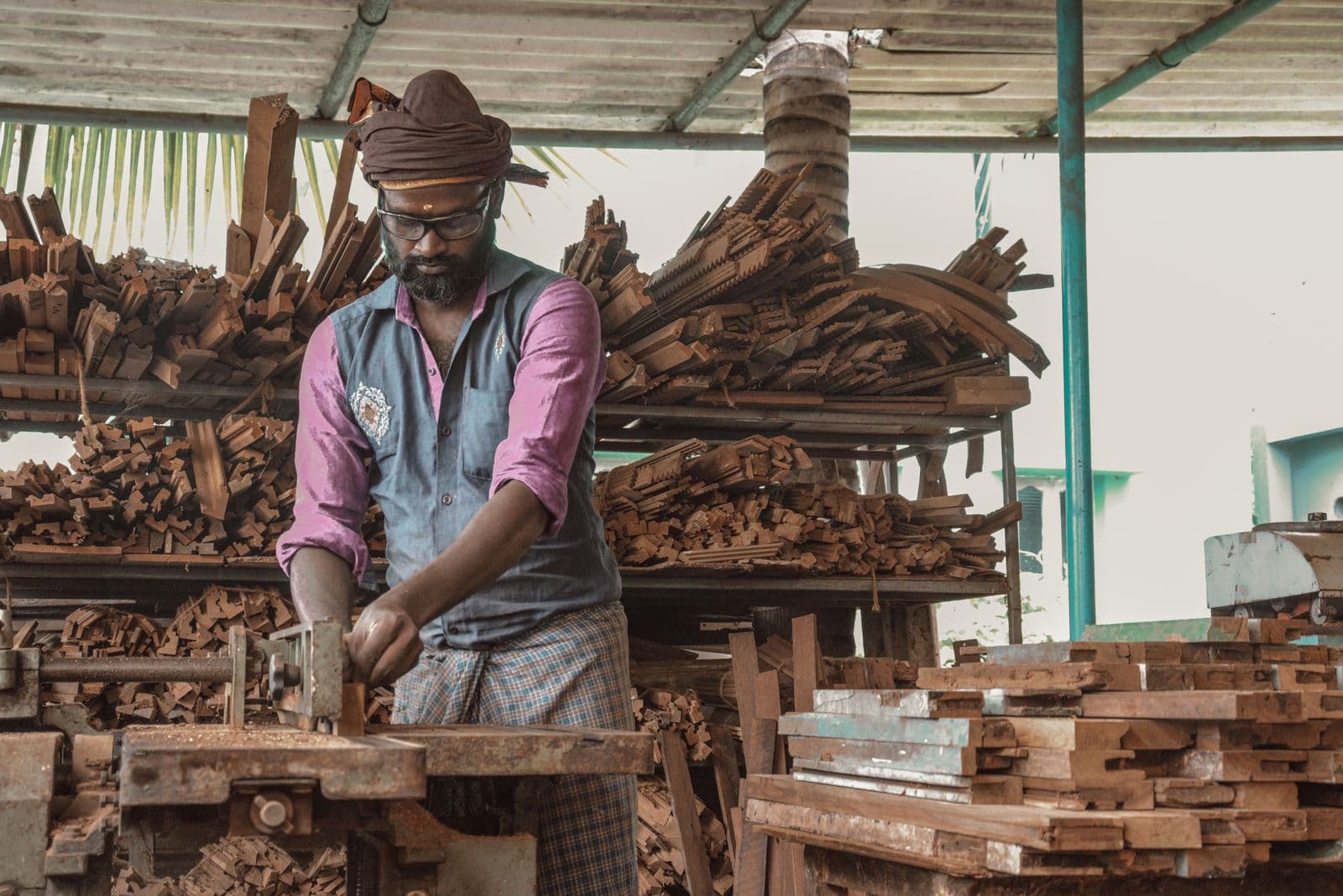 Carpenter working with wood in a workshop
